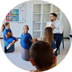 Teacher James Barrett reading a book to students.
