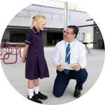MP John Barounis pictured with OneSchool Global Maryborough Year 3 student Myla.